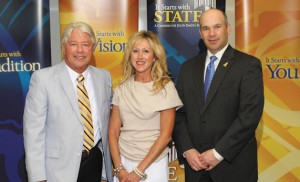 Bruce Laughrey, left and his wife, Kandi, are pictured with College of Pharmacy Dean Dennis Hedge (right).