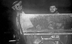 Weary Wil, left, portrayed by Walt Conahan, is driven in the Bummobile by Hobo Day assistant chairman Leon Pfotenhauer in 1954. Originally known as Weary Willie, the hobo icon arrived at the depot Wednesday night to kick off Hobo Week. Conahan also served as the first Weary Wil in 1950.