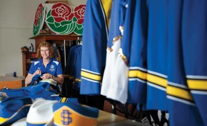 Kathy Larsen has volunteered with The Pride since 1998. Her tasks include fitting, mending and hemming the bandâ€™s uniforms.