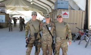 During one of her three deployments, Leah Anderson stands with her sons, Justin Hassebroe, left, and Marcus Short, right, at Kandahar, Afghanistan.