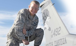 Katie French works on an F-16 jet wing.