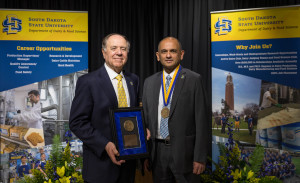 David A. Thompson and Dr. Vikram Mistry were presented with medallions at the investiture ceremony hosted at the South Dakota Agricultural Heritage Museum.