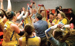 When the Jackrabbits celebrated their first-ever NCAA Tournament second-round win over Syracuse, head coach Aaron Johnston was accidentally struck in the lower lip. He called the injury his favorite souvenir. Photo by Charles Wainwright