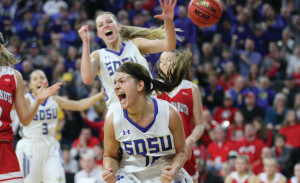 Macy Miller celebrates after defeating USD to win the Summit League Tournament. Photo by Dave Eggen/Inertia