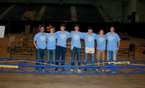 Members of the South Dakota State University bridge building team pose by their finished product at Swiftel Arena during the aesthetics judging before the construction competition began March 23. The team finished second in the regional contest to qualify for nationals May 31-June 1 in Carbondale, Illinois. Members are, from left, captain Ted Sjurseth, Matthew Harris, Chris Mulholland, Justin Goossen, Matthew Heikens, Matthew Hoffman and captain Tyler Tetrault.