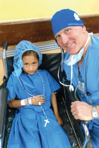 Dr. Cory Kirby poses with a patient.