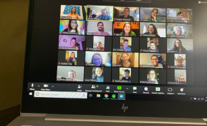 A computer screen showing several people in a Zoom session.