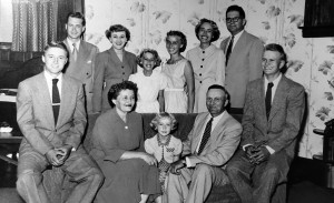 A black and white photo of a large family.