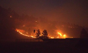 A wildfire threatens to burn homes.