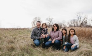 Jill Resler poses with her husband and three daughters.